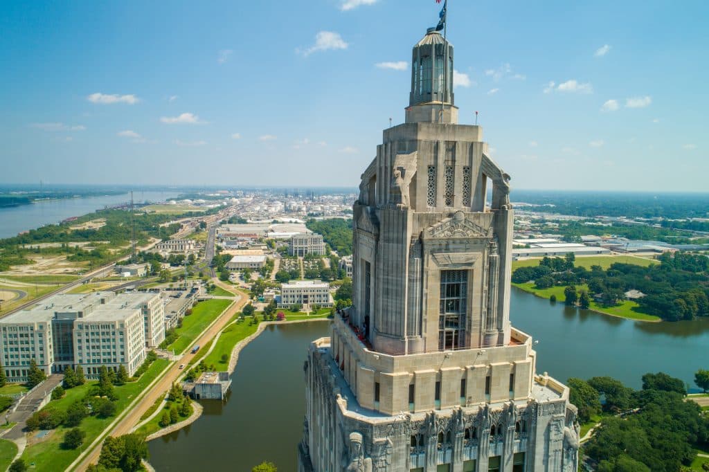 Aerial closeup of the Louisiana State Capitol Building and welcome center in Baton Rouge