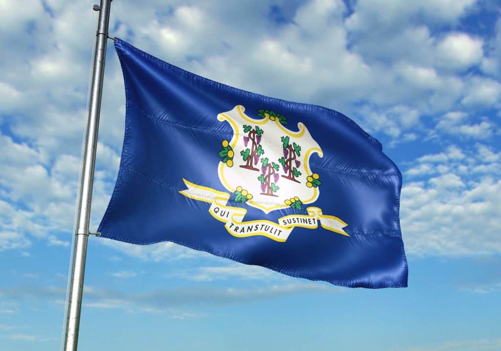 Connecticut state of United States flag on flagpole waving cloudy sky background realistic 3d illustration
