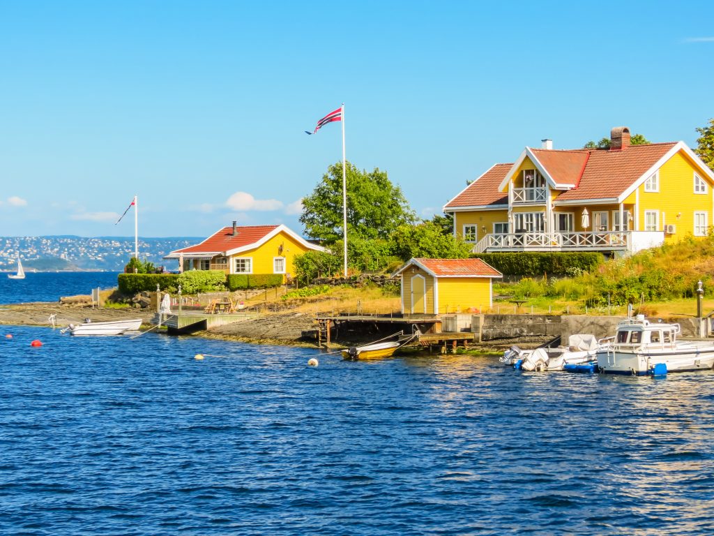 Colorful houses at the Oslo Fjord, Norway. Landscape of Norway fjord on summer day