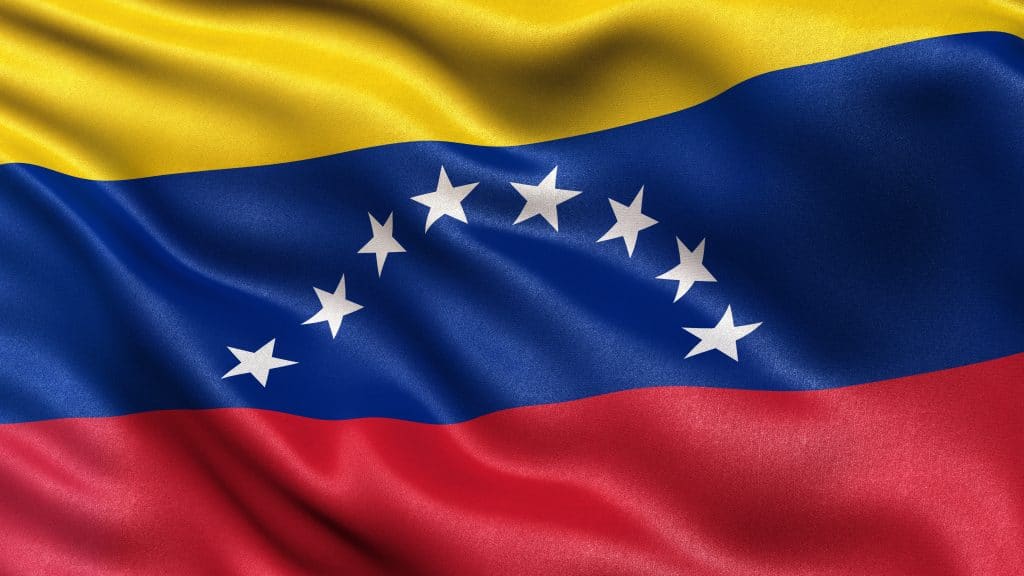 Flag of Venezuela with fabric texture waving in the wind